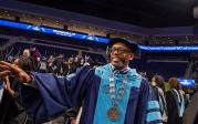Brian O总裁. Hemphill, Ph值.D., waves to students as he exits the the 文学院 and 信 commencement on May 6. 图Chuck Thomas/ODU
